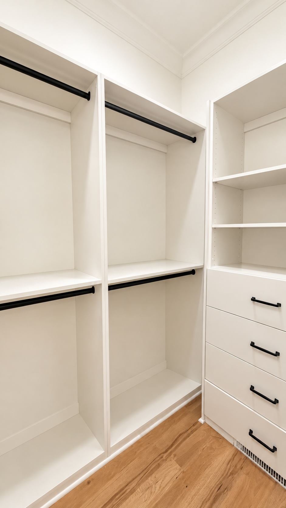Audubon Suite empty walk-in closet with built-in shelving and drawers