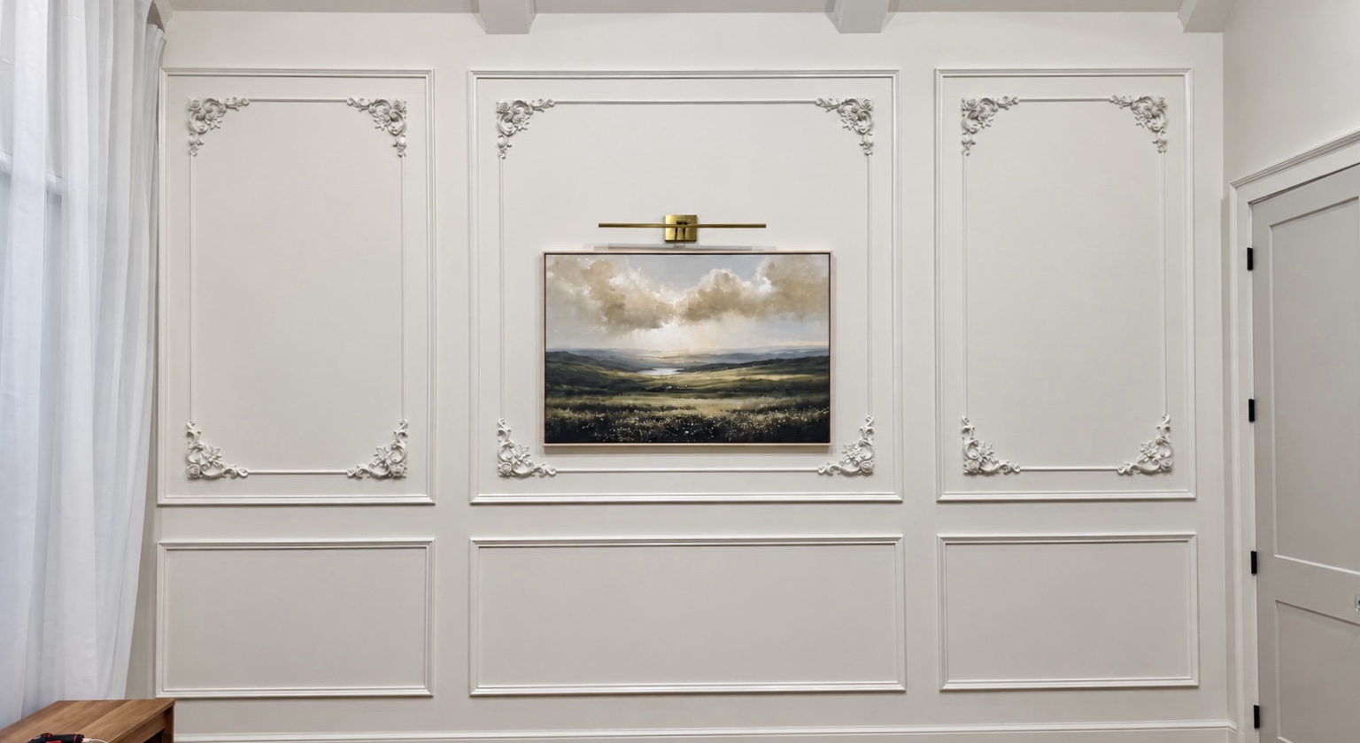 Audubon Suite paneled wall with landscape artwork and brass picture light