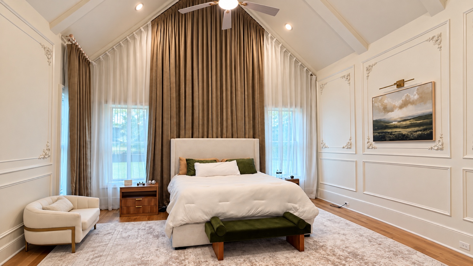 Audubon Suite bedroom with vaulted ceiling, layered curtains, and green bench