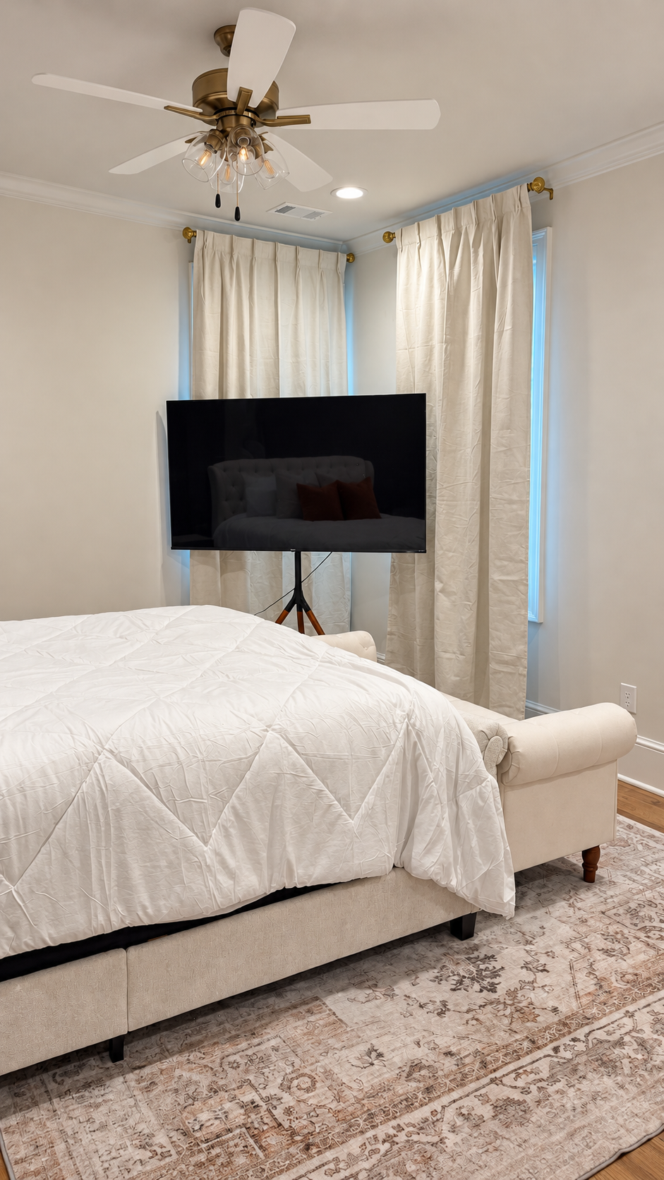 The Bloom Room television and curtained windows