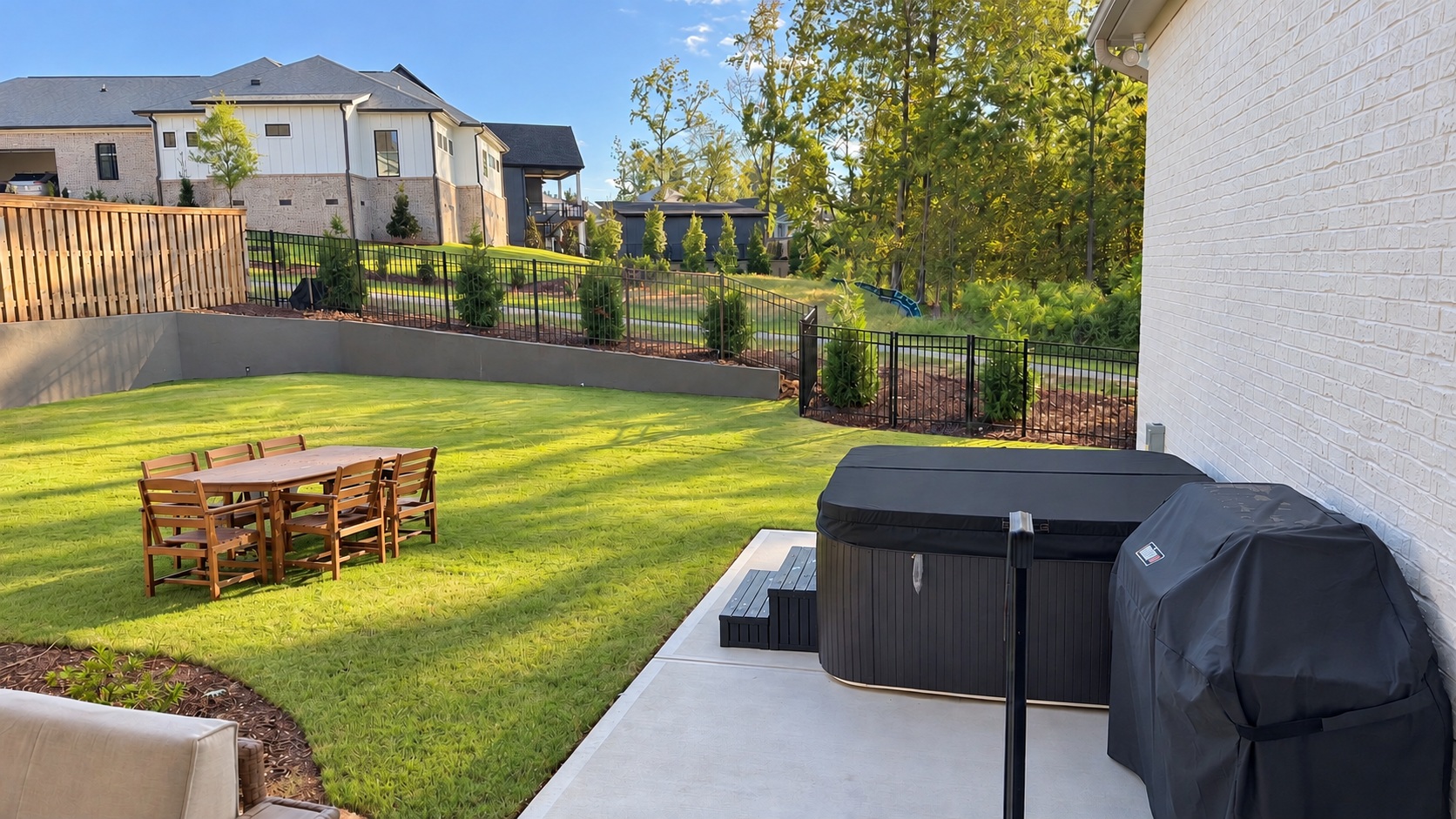 Backyard dining, hot tub and grill area