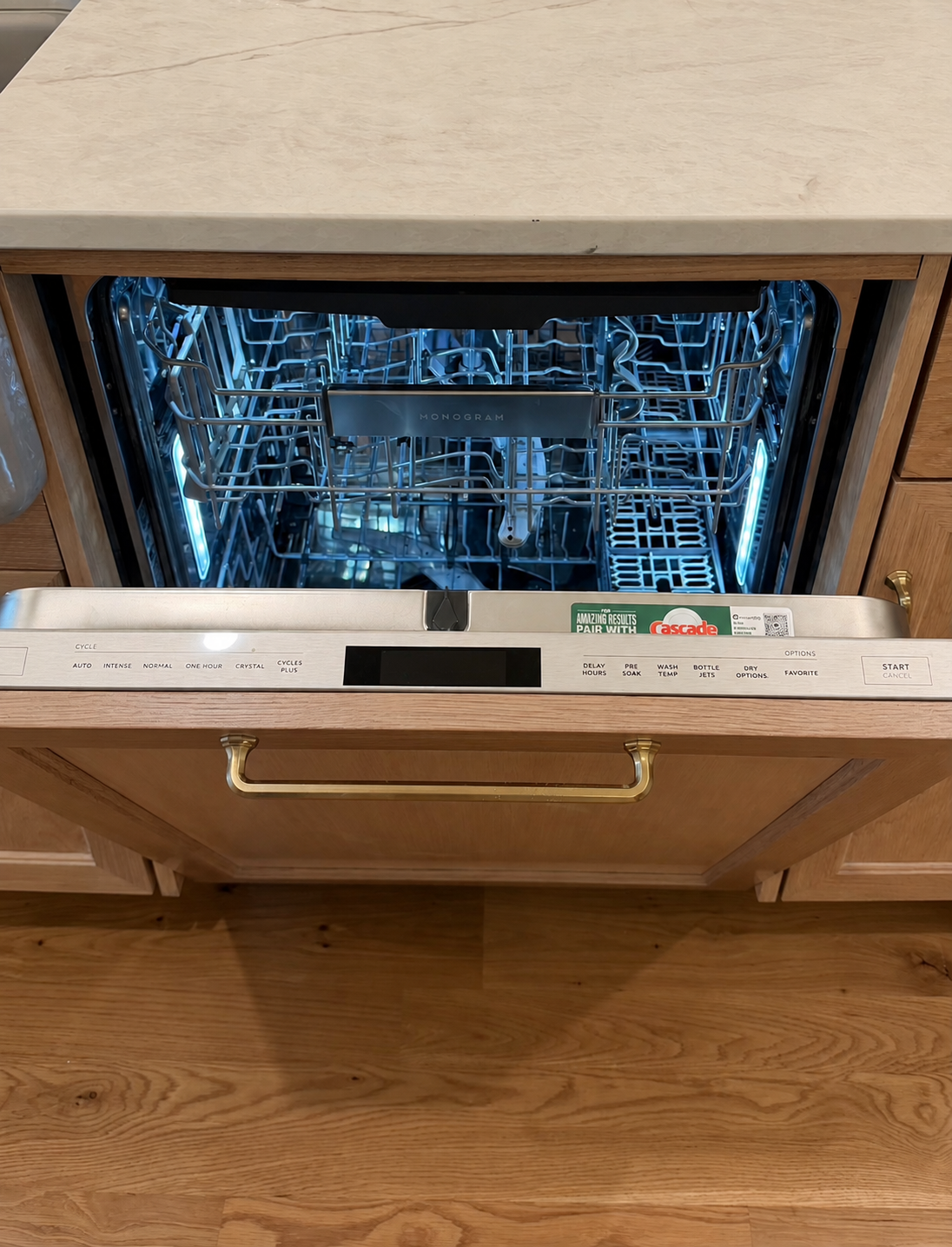 Paneled Monogram dishwasher with illuminated interior racks