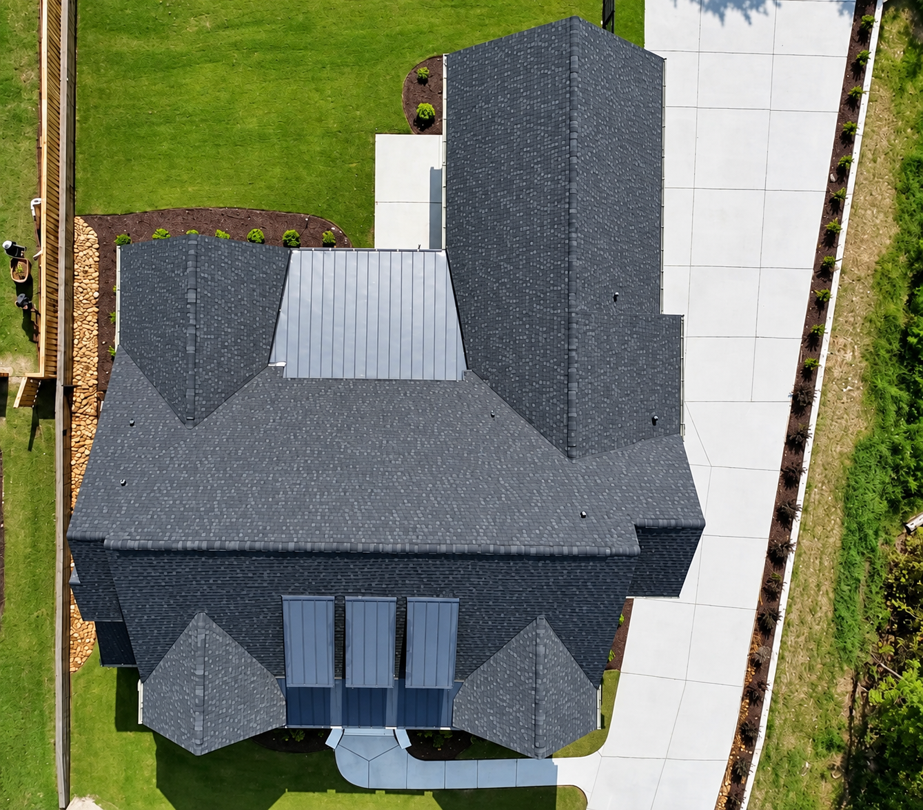 Overhead aerial view of the residence, driveway and lawn